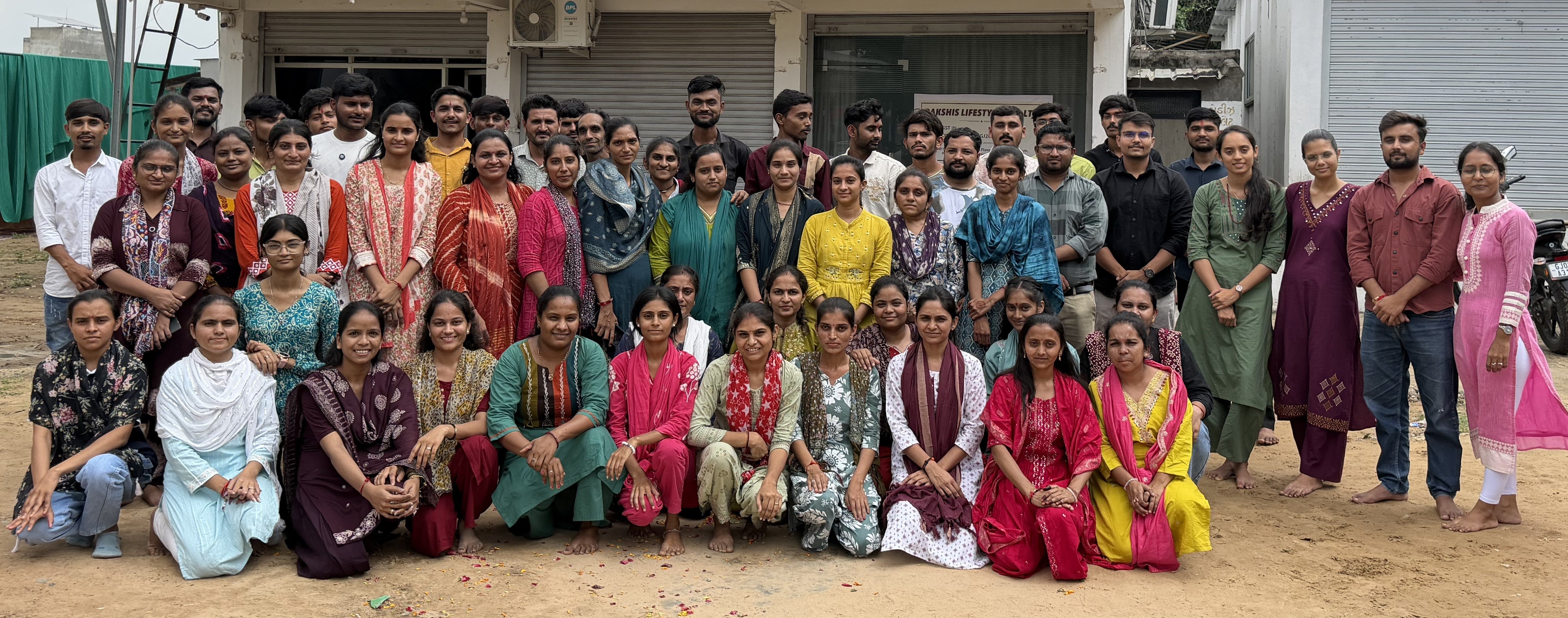 The Dakshis team together outside our office